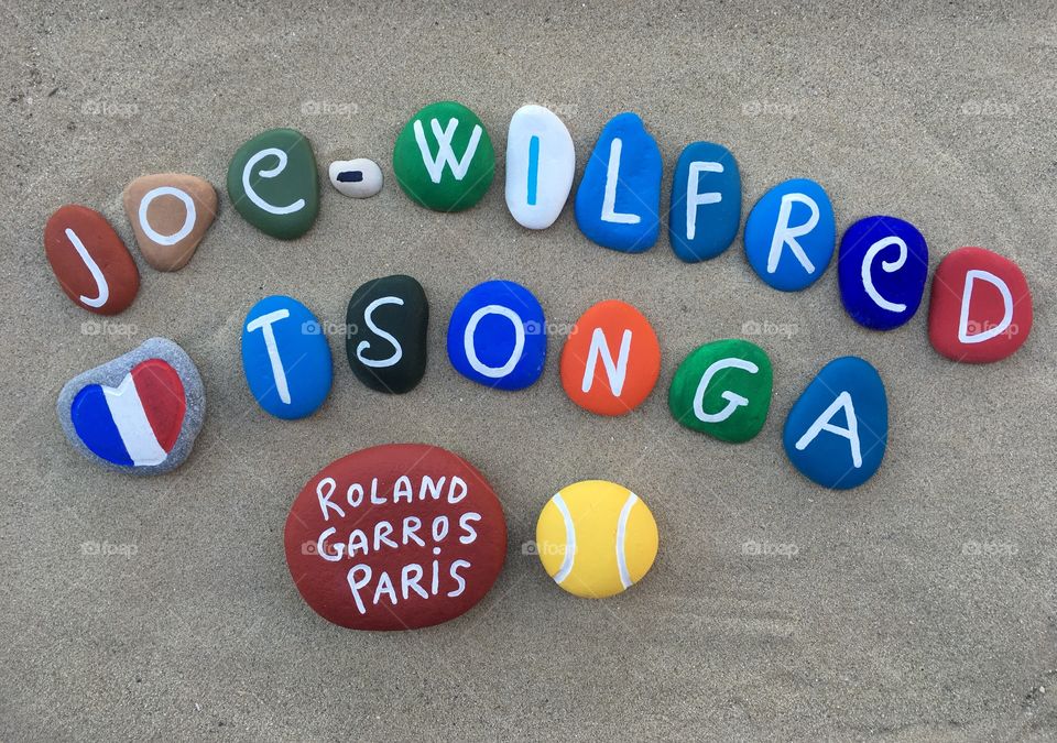 Joe-Wilfred Tsonga, french professional tennis player at Roland Garros, souvenir on colored stones 