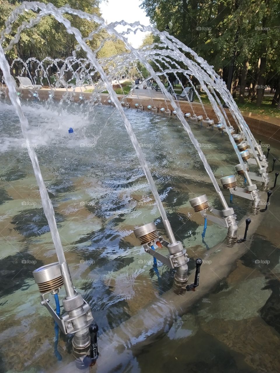 Parallel streams of water from the city fountain.