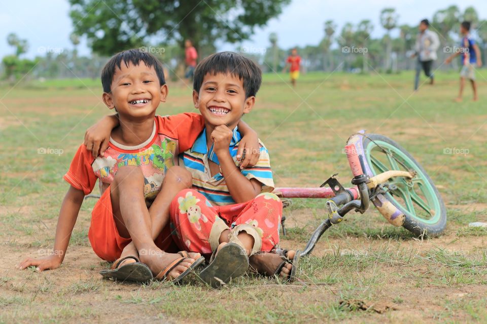 Smiling boy. A kid smiling after playing and racing a bike-cycle