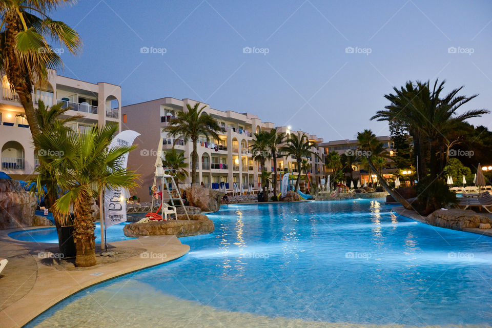 Hotell Alcudia Pins in Alcudia Majorca. View over poolarea at sunset.