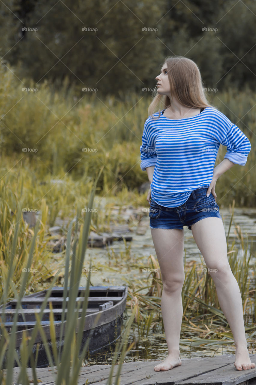 A girl with blond hair on the lake in a striped shirt and short denim shorts on the background of grass, reeds and an old wooden boat
Girl, woman, man, blonde, blonde hair, striped shirt, short shorts, denim shorts, shore, lake, grass, reeds, old boat, feelings, emotions, tenderness, love, lifestyle, lifestyle, vacation