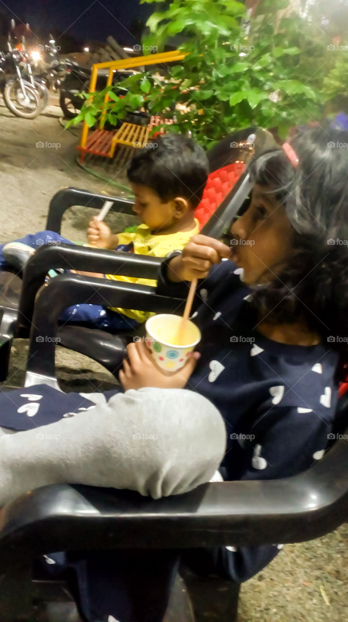 Kids having an energy drink in the evening