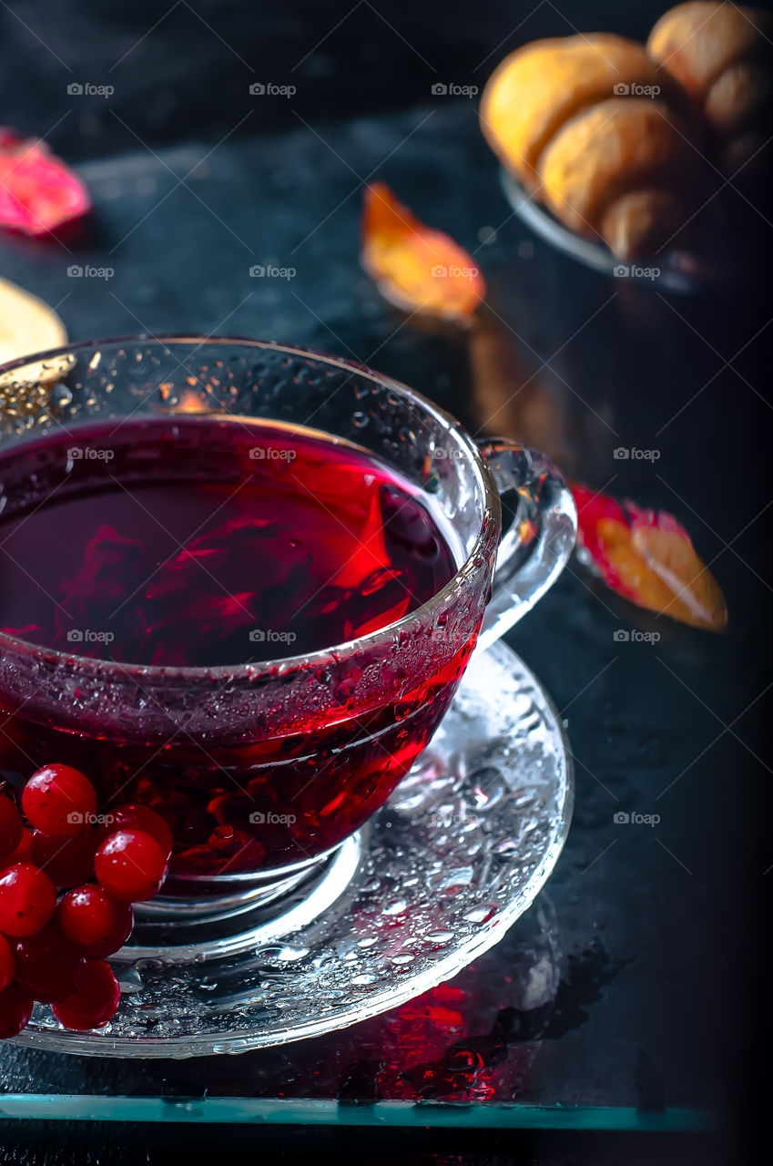 Ice tea in glass cup with saucer