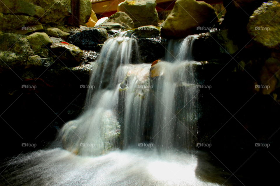 Sunlight on rocky waterfall