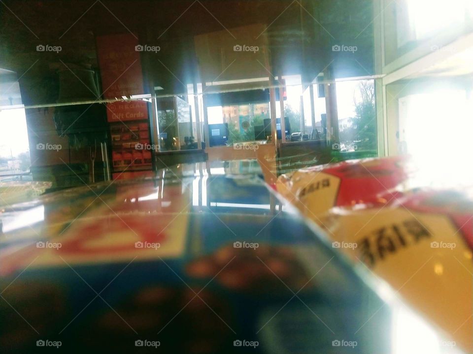 Picture taken through a candy case in a concession stand located inside a movie theatre