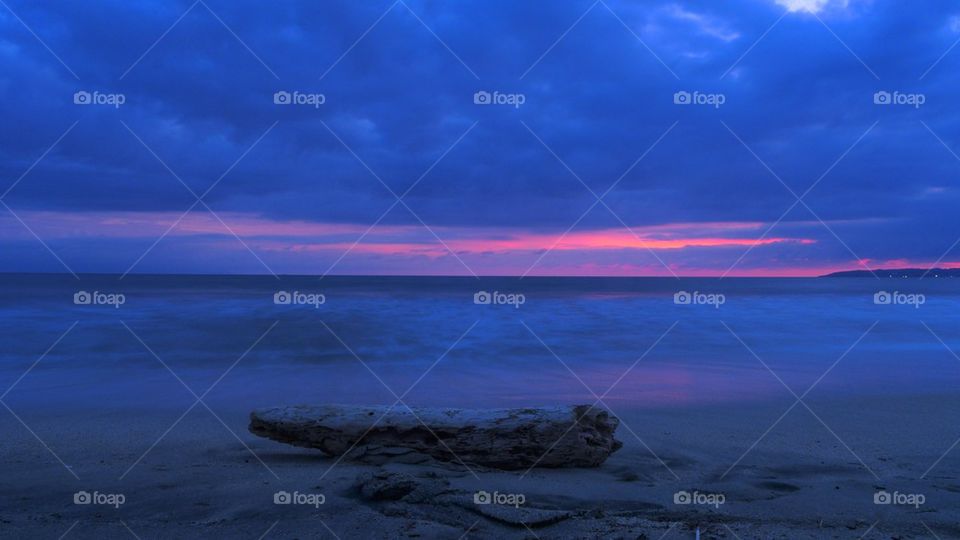 Beach log and sunset