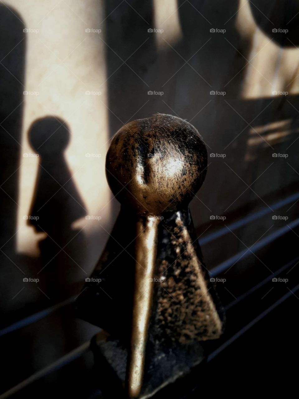 spherical element of a metal shelf  and its shadow