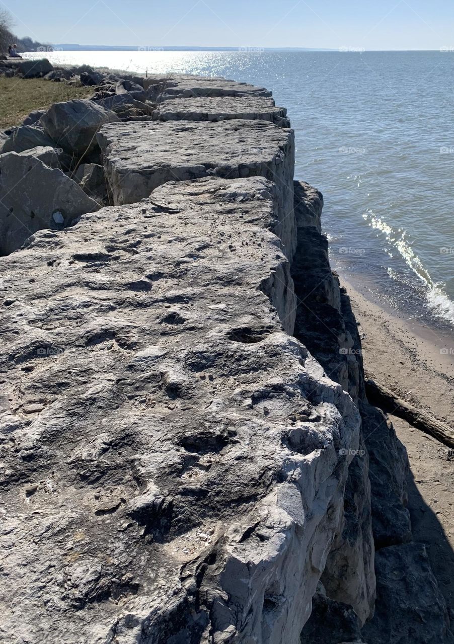 Summer beach vibes on a rock wall