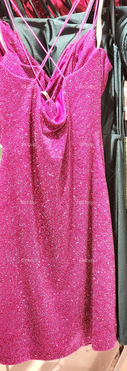 sparkly hot pink strappy dress for a glam Barbie style evening out for sale in a mall store