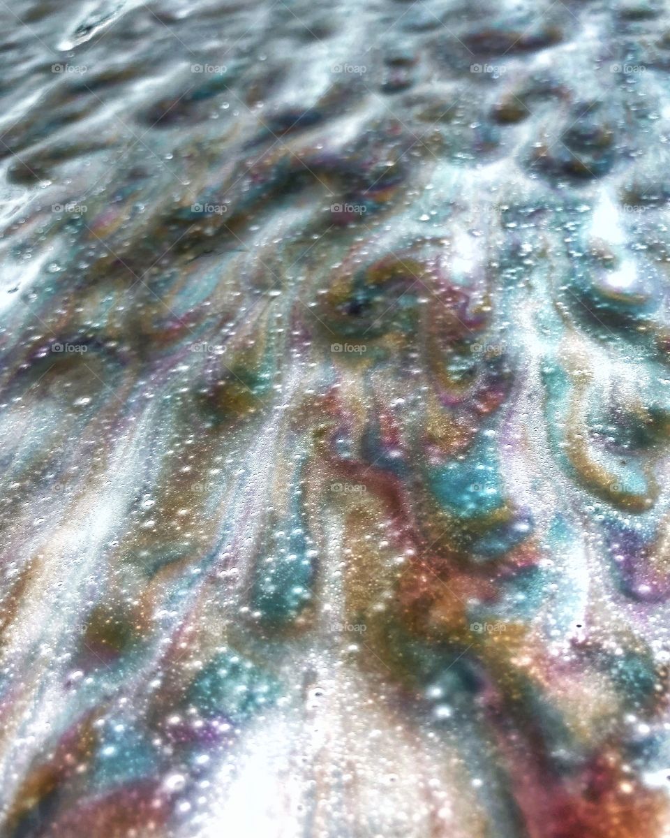 Soap on a car windshield at car wash 