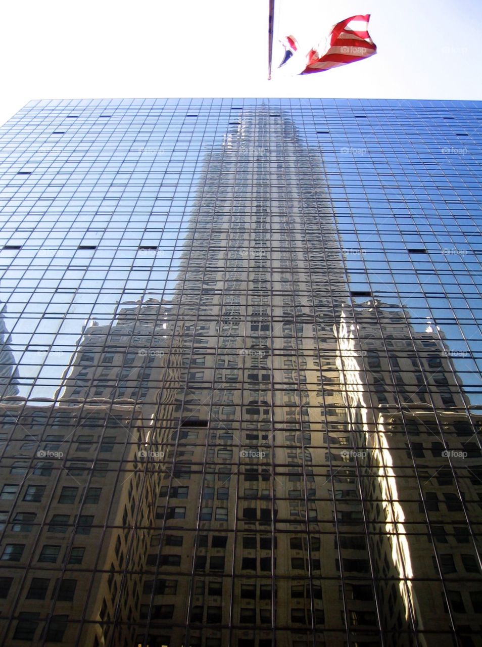 American Pride. Chrysler building reflection with the American flag