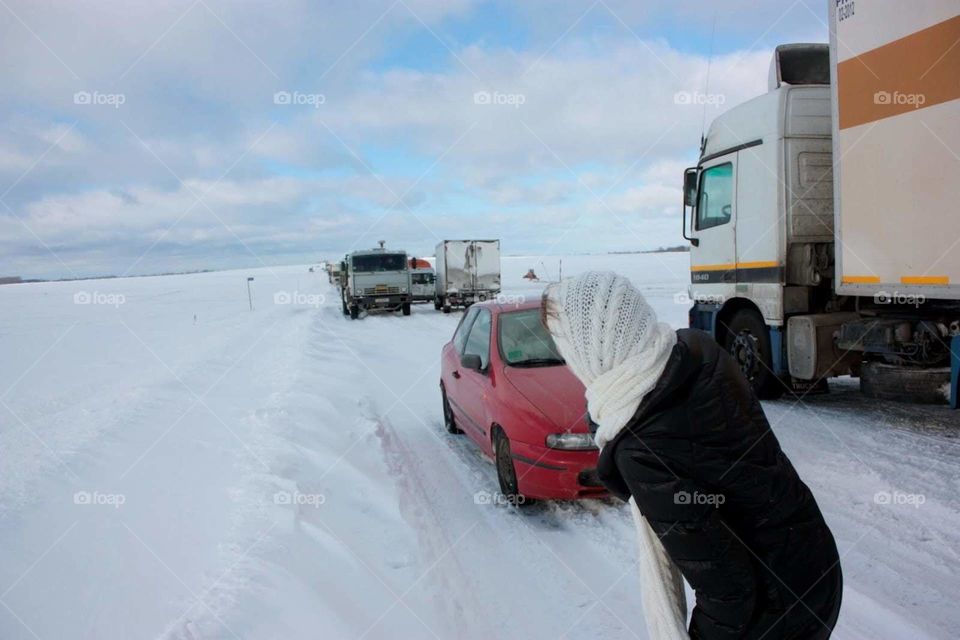 Traffic in the field full of snow  