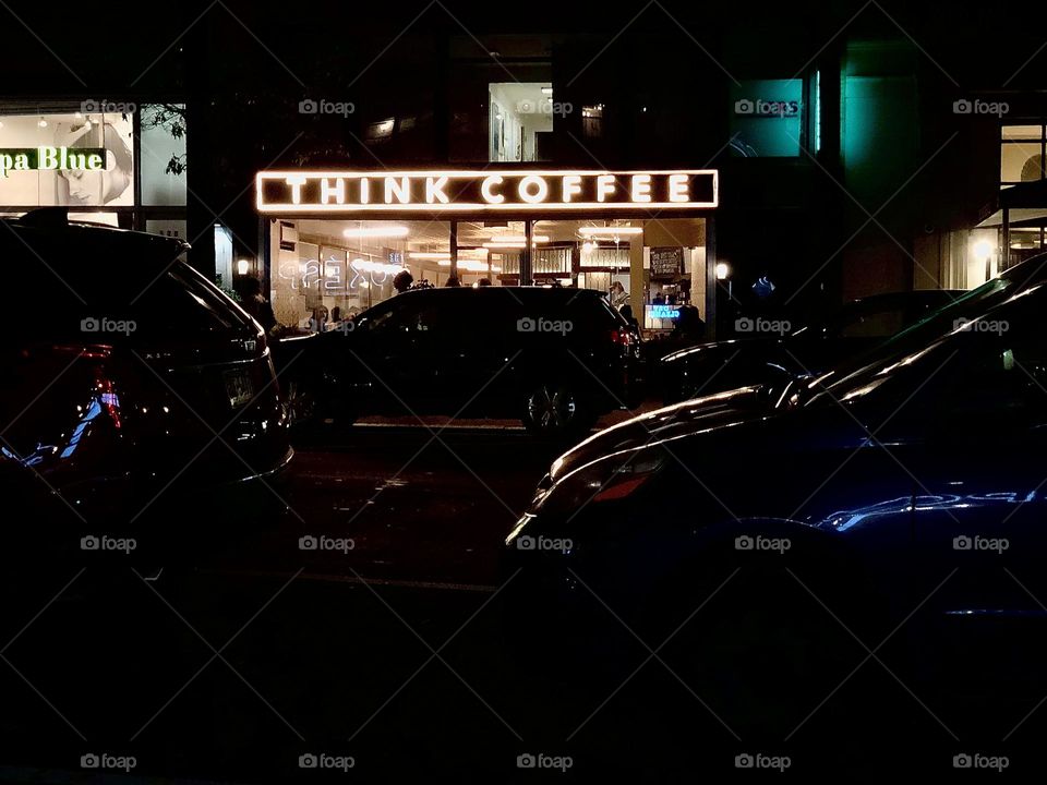 Coffee shop lights at night, lit up in the dark, think coffee sign lit up, coffee sign in New York 
