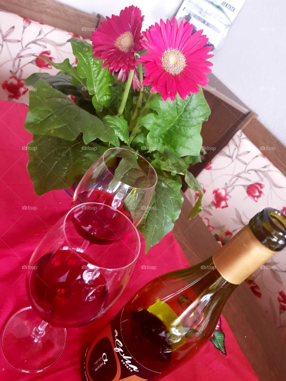 Red wine with beautiful flowers and whispers of hopeful