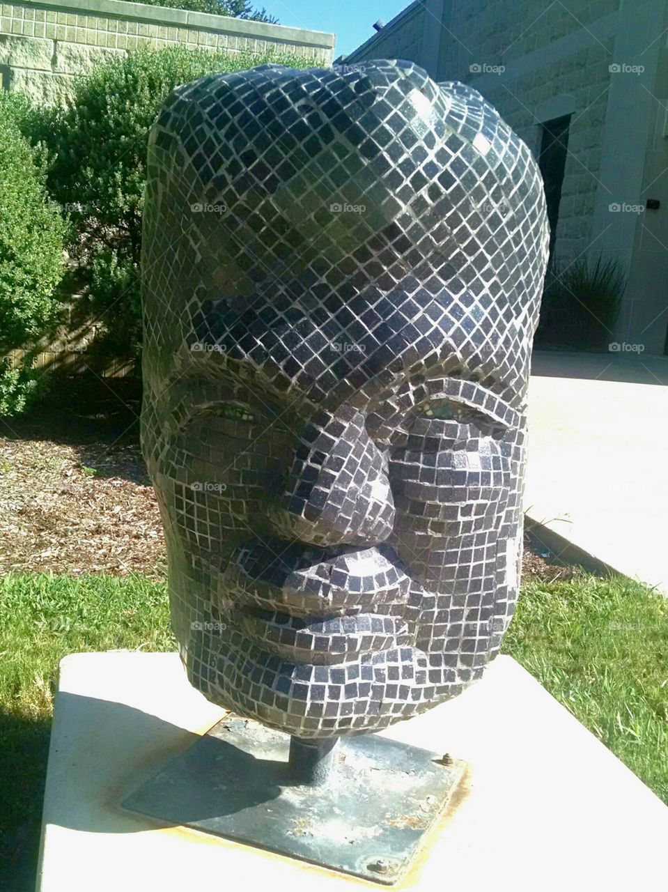 glass tile face statue