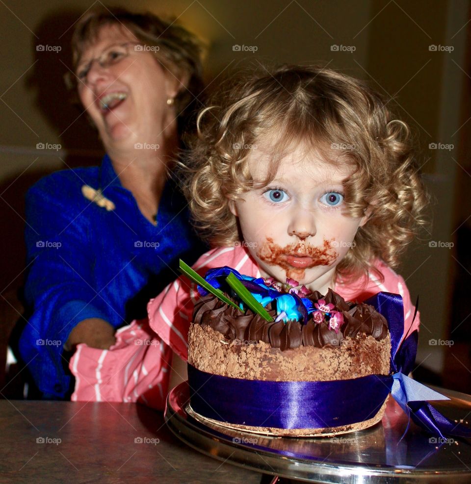 Little girl caught taking bite of entire cake - grandma laughs