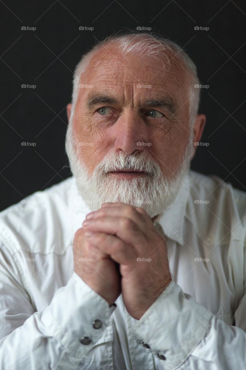 Portrait of an adult, emotions, wrinkles and the history of a person’s life in one portrait. Unique face skin stories