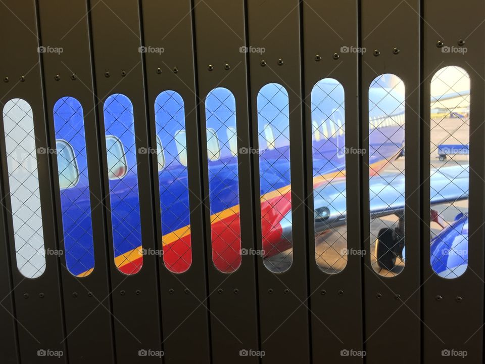 Boarding on a jet bridge. Boarding jet bridge to Southwest plane