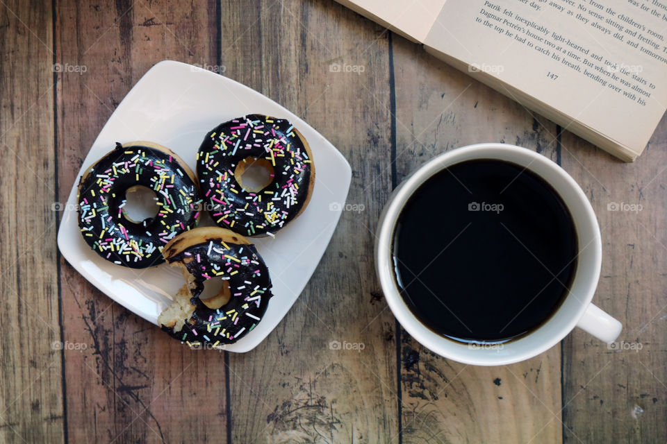 Chocolate doughnuts with coffee