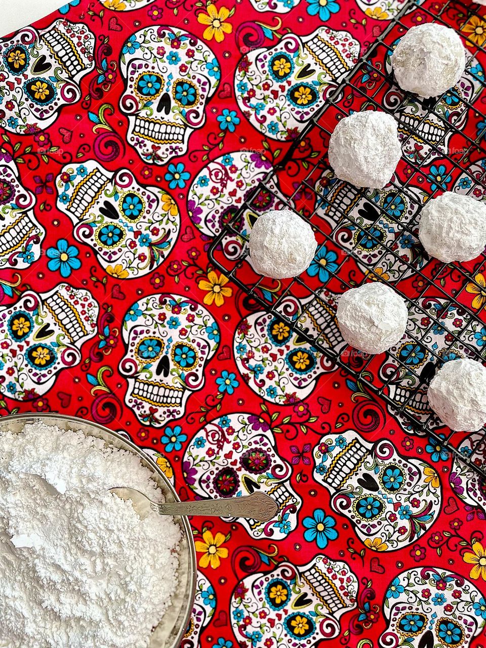 Baking at home, making cookies with toddlers, Mexican wedding cookies with skull background, cookies on display, baking with love