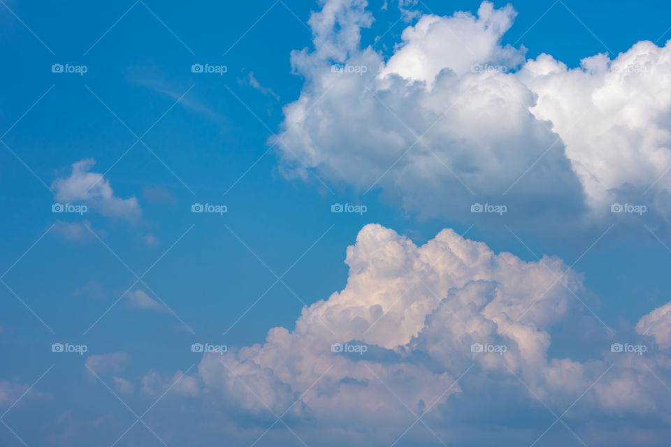 The beauty of the sky with clouds and the sun.