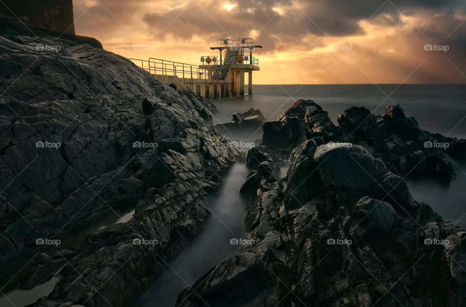 Sunrise at Blacrock diving tower on Salthill beach in Galway, Ireland