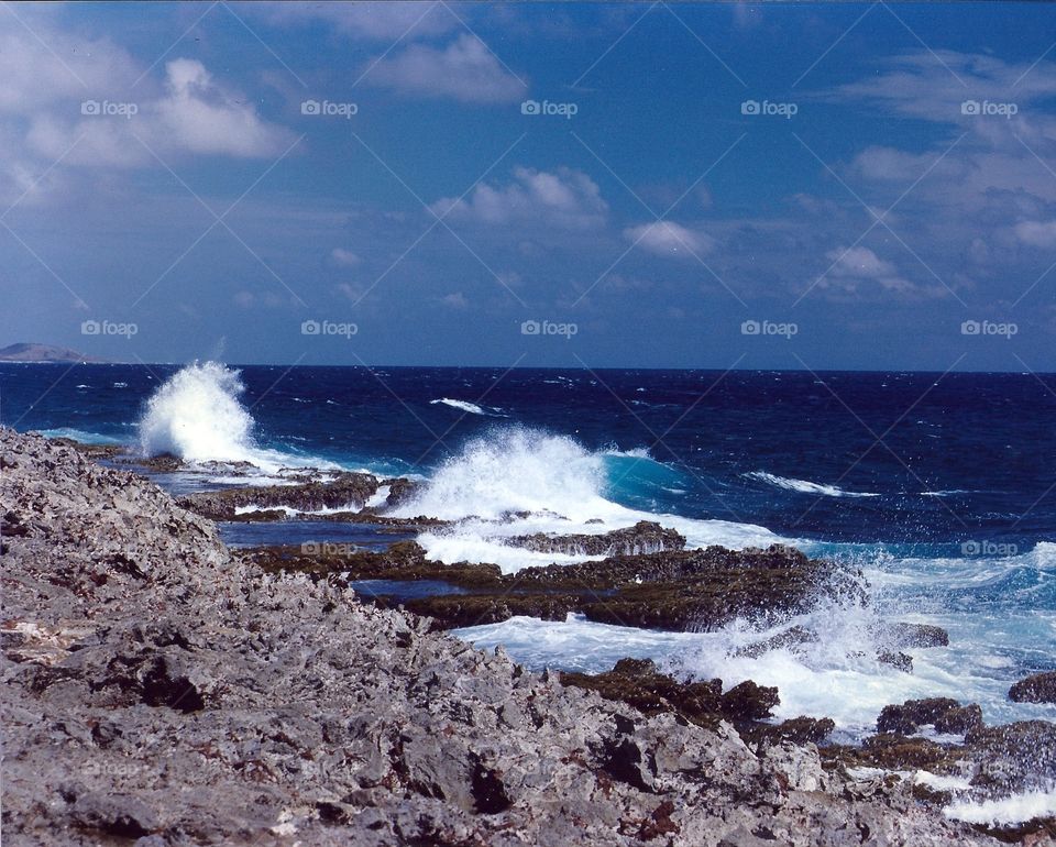 waves hitting the rocks in Aruba