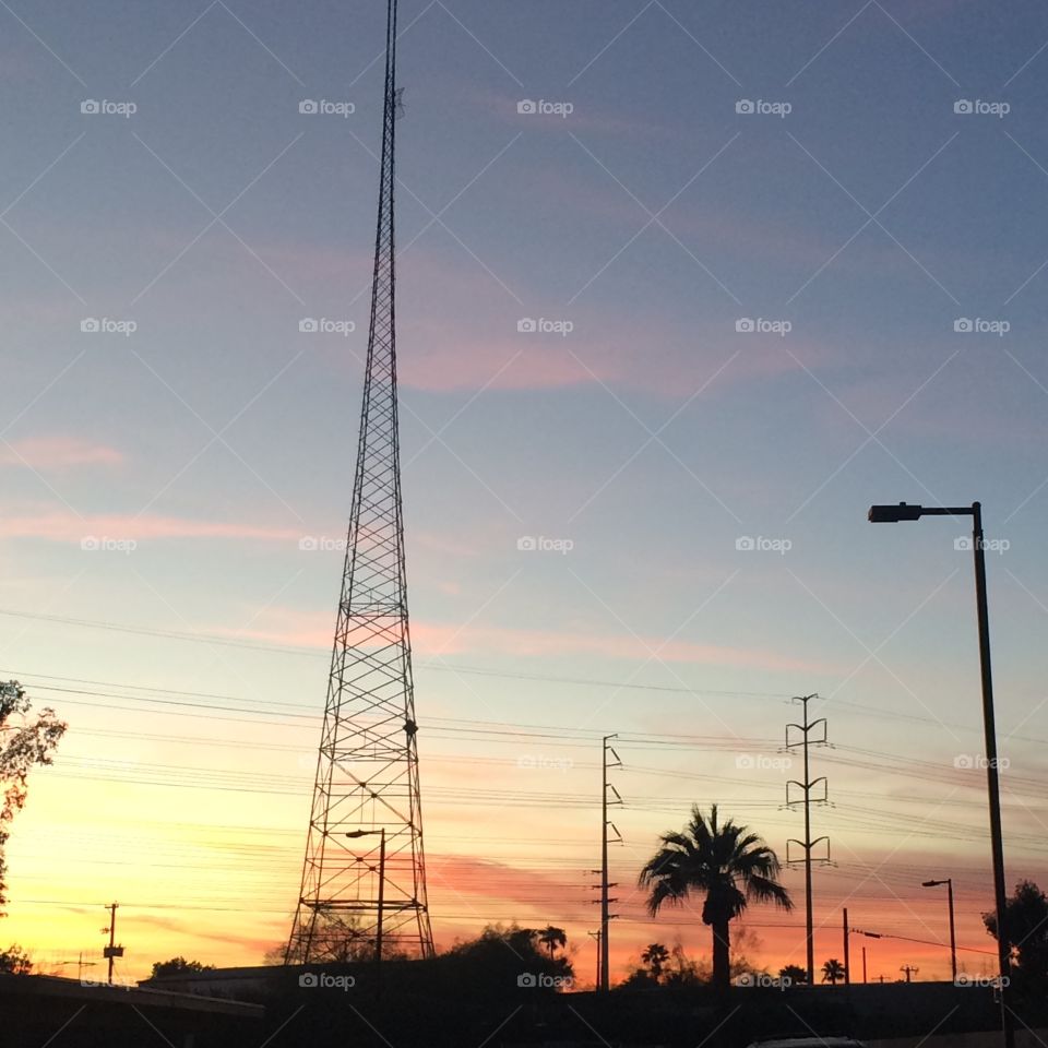 Sunset behind tower.