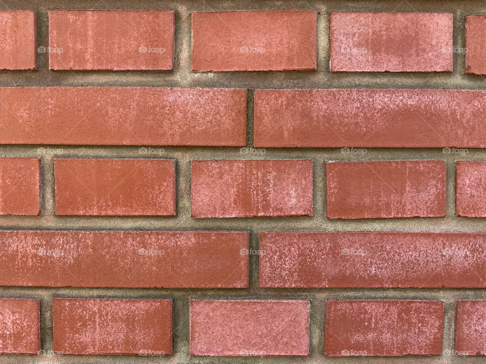 A closeup of a red brick wall surface background.