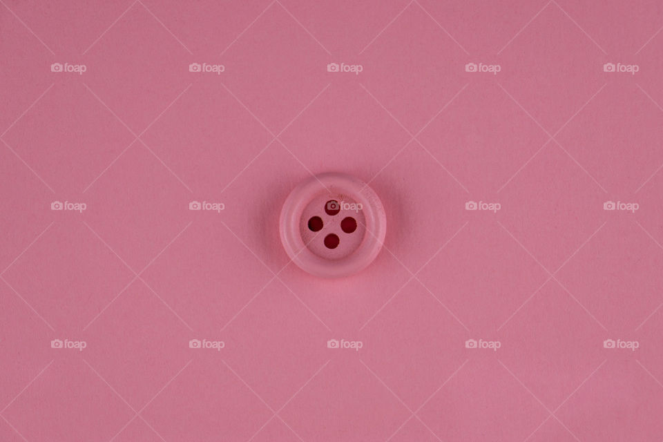 Creative background with pink button