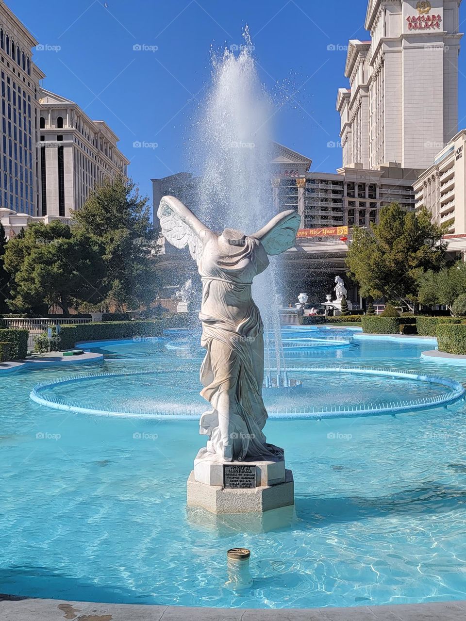 Headless statue in front of fountain at Las Vegas