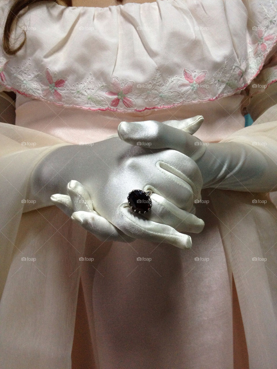 Hands  with white gloves and ring