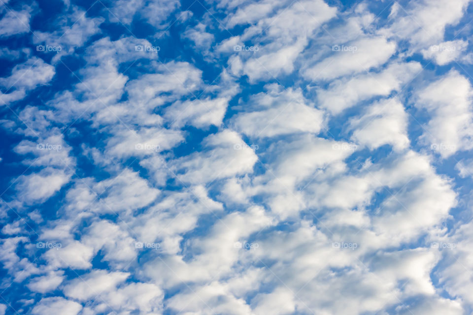 The beauty of the sky with clouds and the sun.