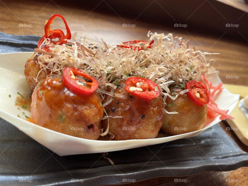 Spicy Takoyaki with bonito flakes and chillies 
