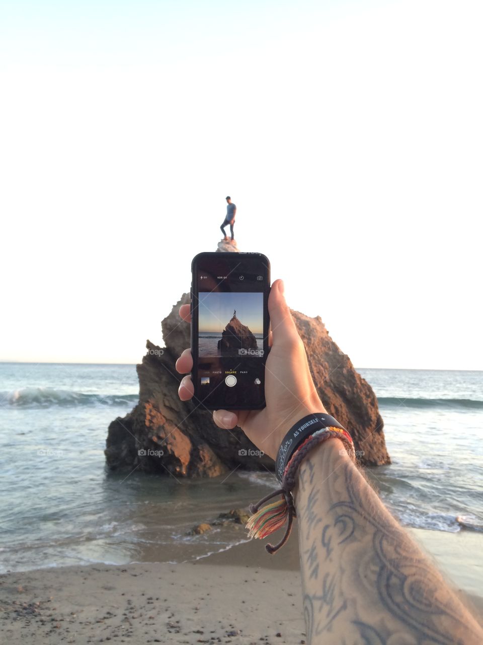 iPhone photo, guy on a rock.