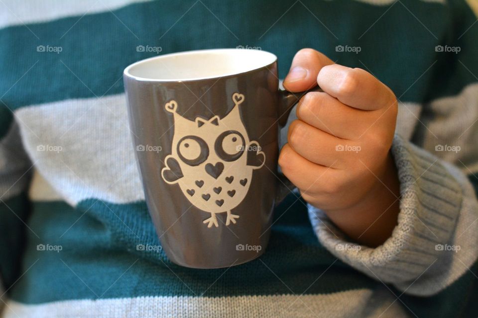 cup of tea in the hand child cozy winter