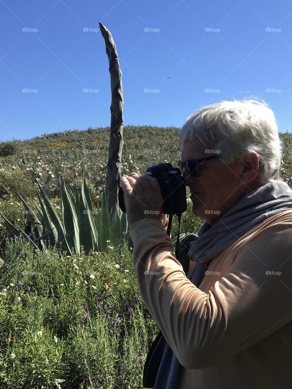 Man with light on his back picturing landscape 