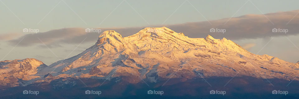 Sunlight on snowcapped mountain