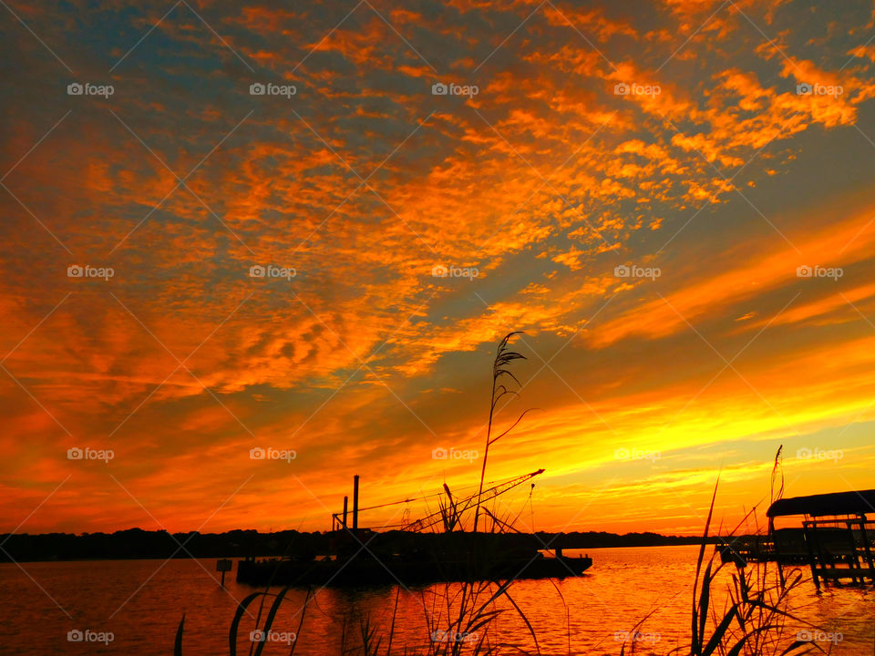 The sky was filled with the most brilliant orange complimented perfectly with hues of gold, yellow, red and crimson. An orange haze had casted over the water, reflecting off every wave.  Finally,the sun disappears along with the shine. I can only wait to see another magical moment of beauty and warmth! I can only wait for another sunset! Enjoy!