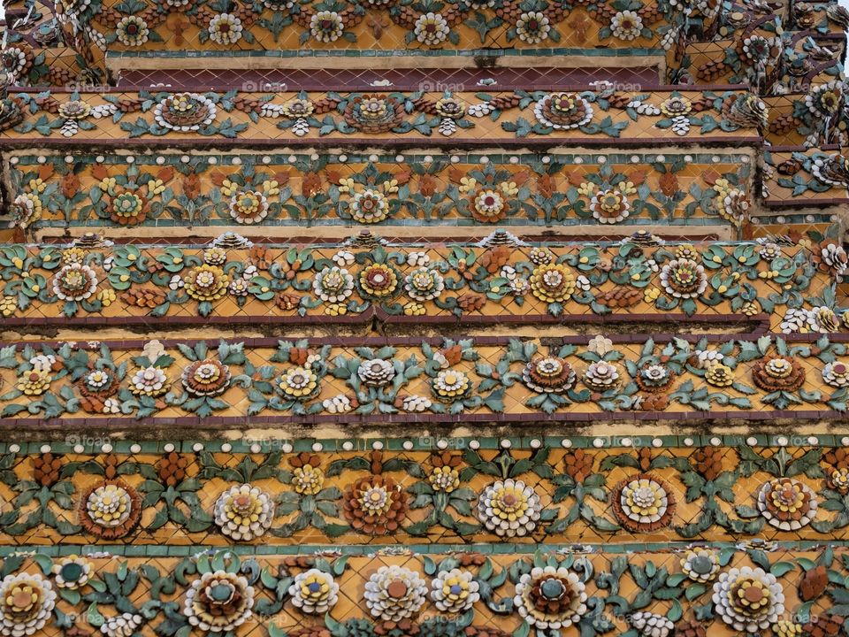 
Beautiful mold flowers on pagoda of Wat Pho also spelled Wat Po, is a Buddhist famous temple in Bangkok Thailand