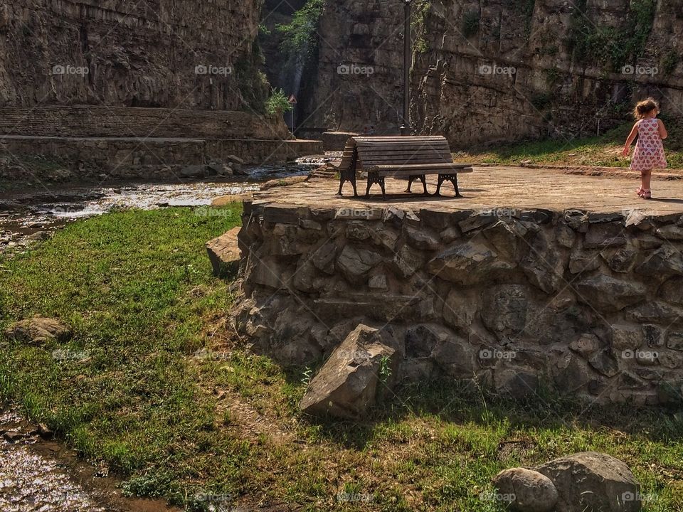 Bench. . I made this shot in Tbilisi, Georgia. I saw a man with his daughter. They were walking together. She went ahead of him and that when I pulled out my phone. 