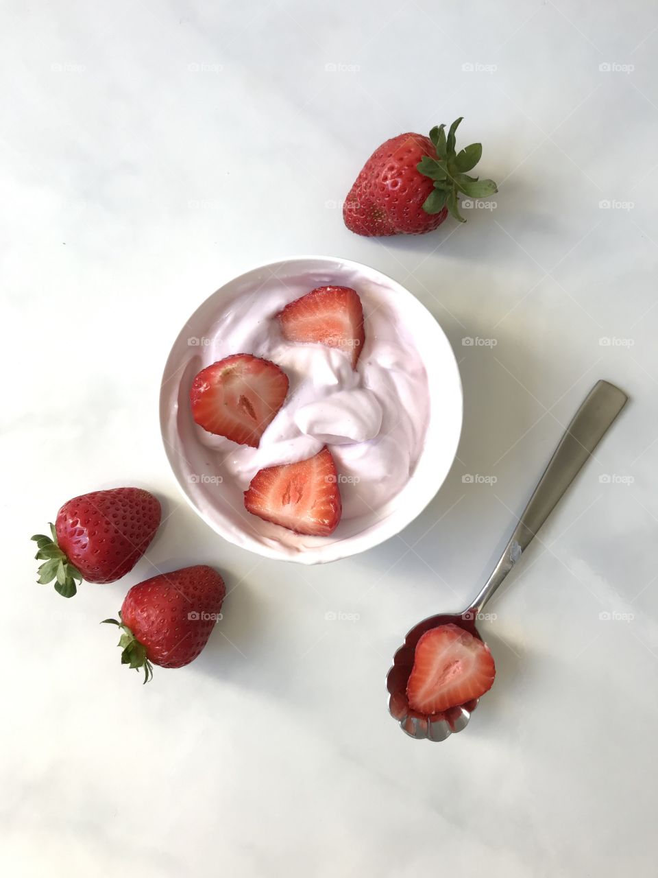 A healthy lunch of yogurt with fresh strawberries!