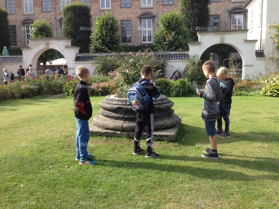Copenhagen  Sweden, Group children playing with Smart Phones 