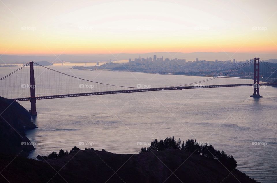 Golden Gate Bridge and San Francisco at sunrise.