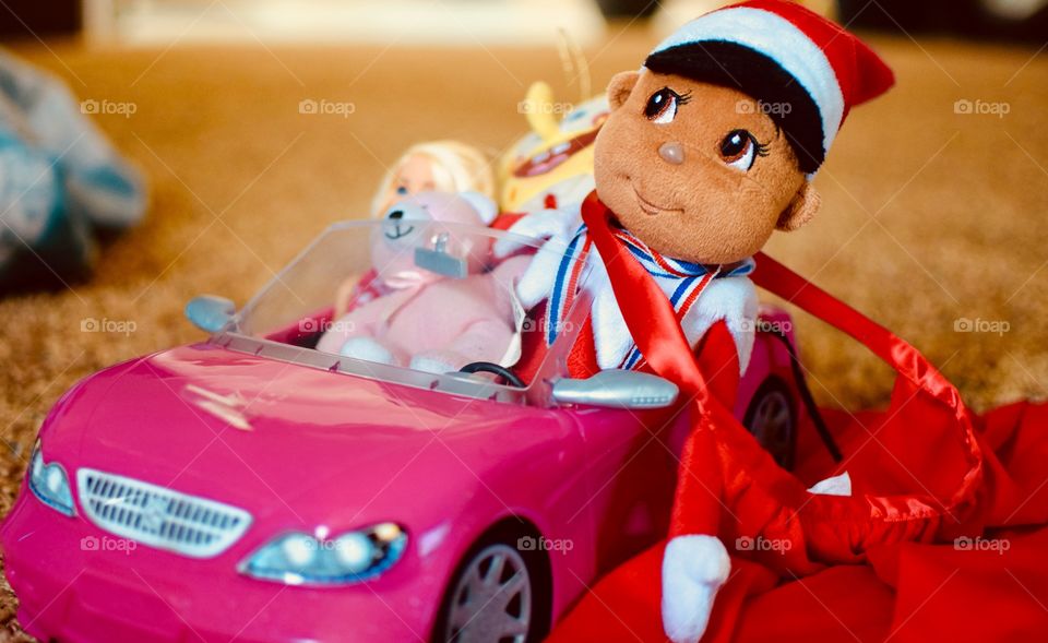 Elf on the shelf in a car