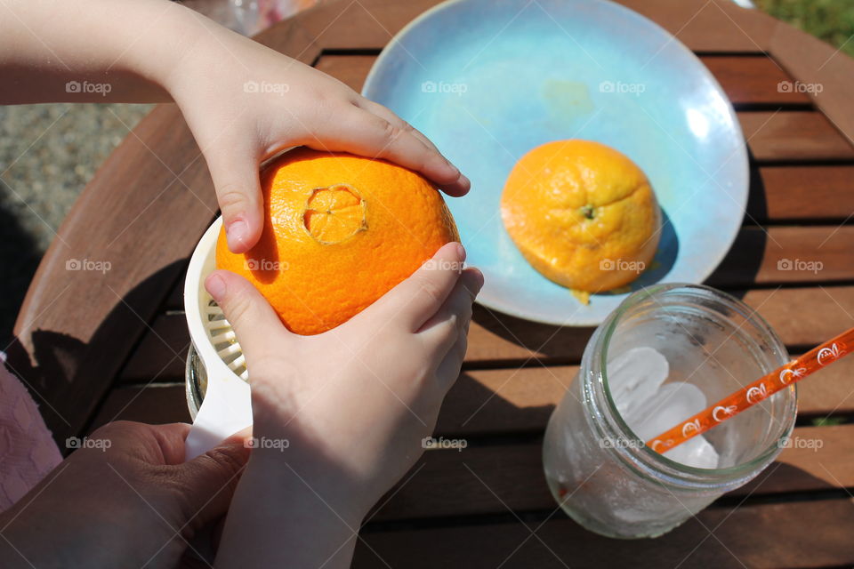 A person preparing juice