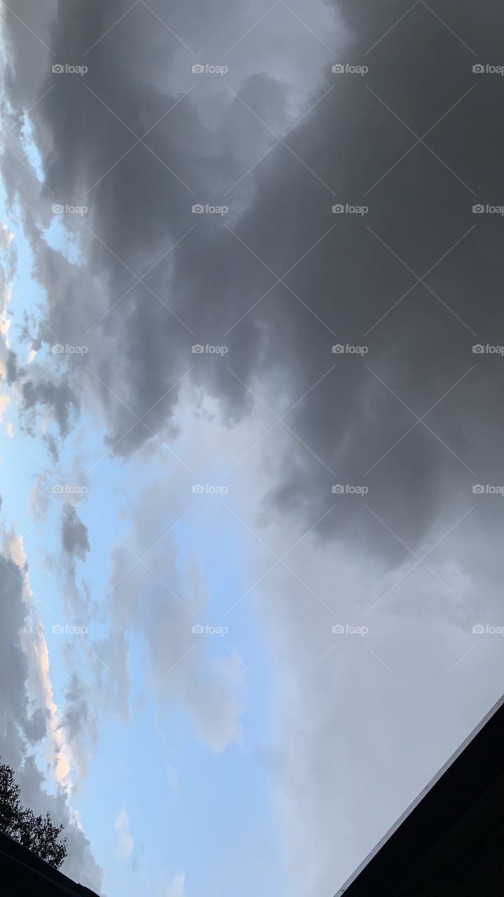 Contrasting sky filled with rain 