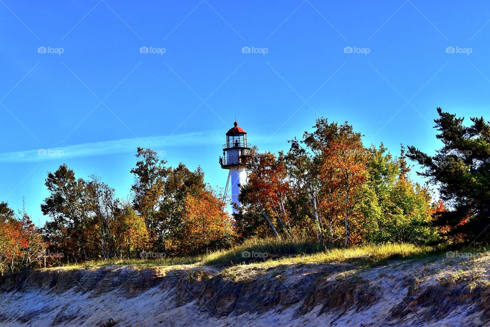 Beach and lighthouse in fall