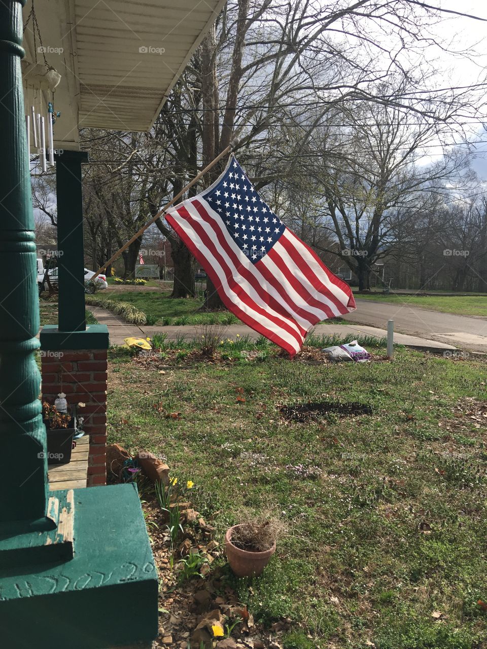 May God Bless America and the whole world! My flag is happily blowing in the wind.