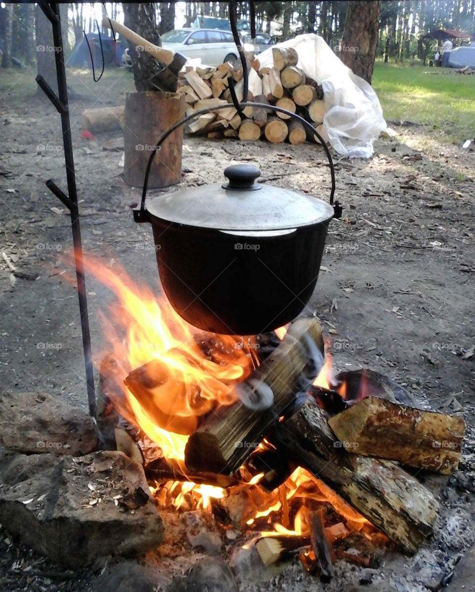 tourist camp. pot on the fire with a meal